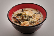Hot chicken soup with lime, spinach, shiitake mushroom, coconut milk and cellophane noodles